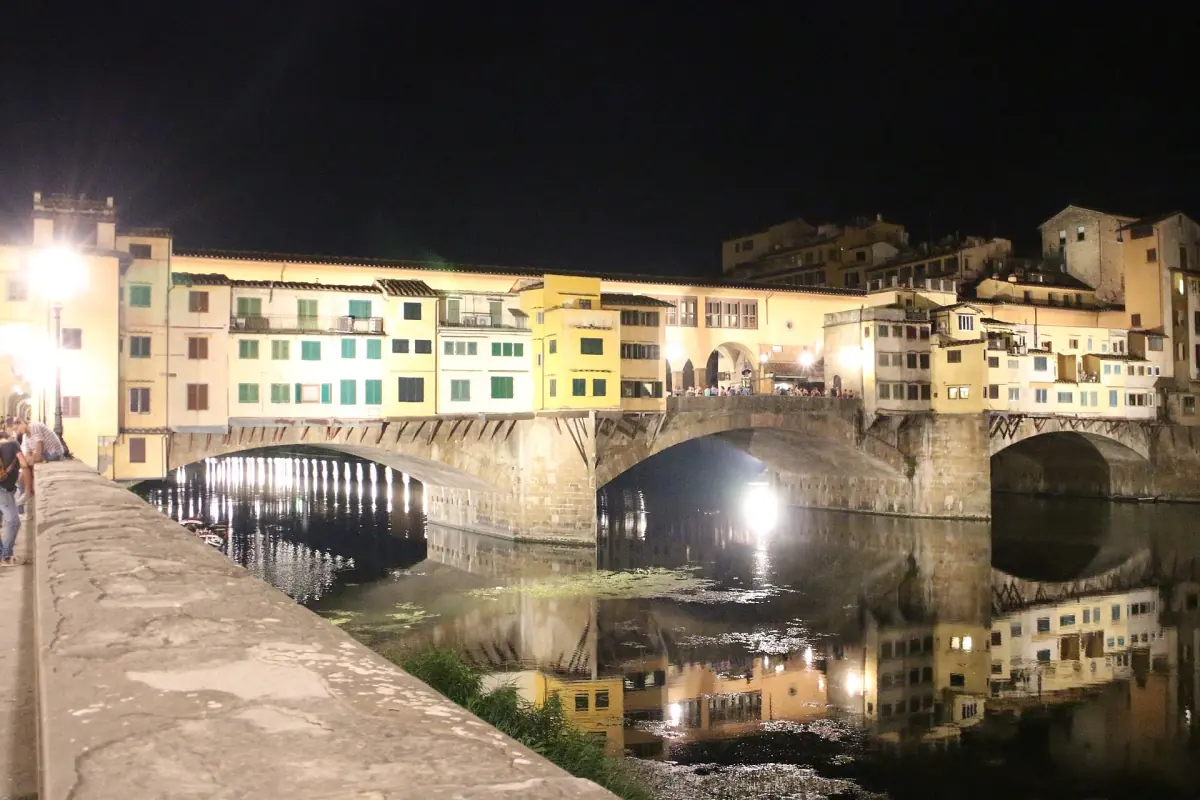 The bridge shops lit at night